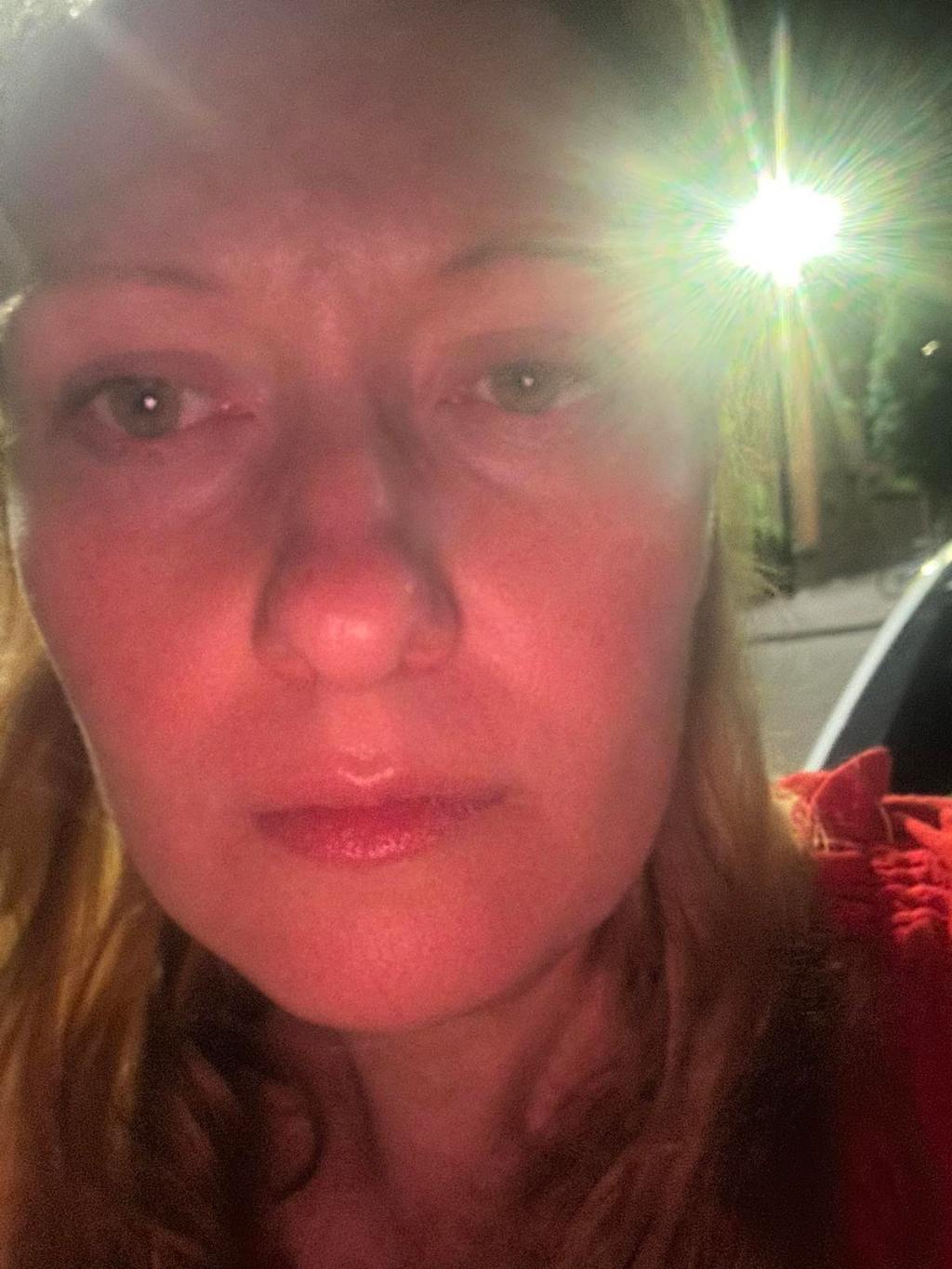 A woman's face with a light behind her
